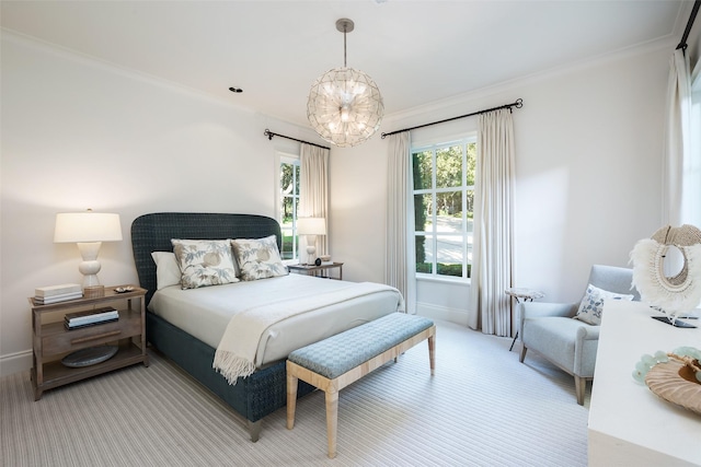 carpeted bedroom with a chandelier and ornamental molding