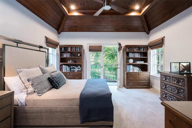 carpeted bedroom featuring ceiling fan, wooden ceiling, access to exterior, and a towering ceiling