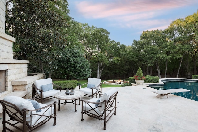 view of patio terrace at dusk