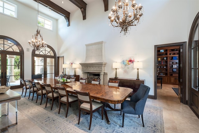 dining space with a towering ceiling, french doors, beam ceiling, and light tile patterned floors