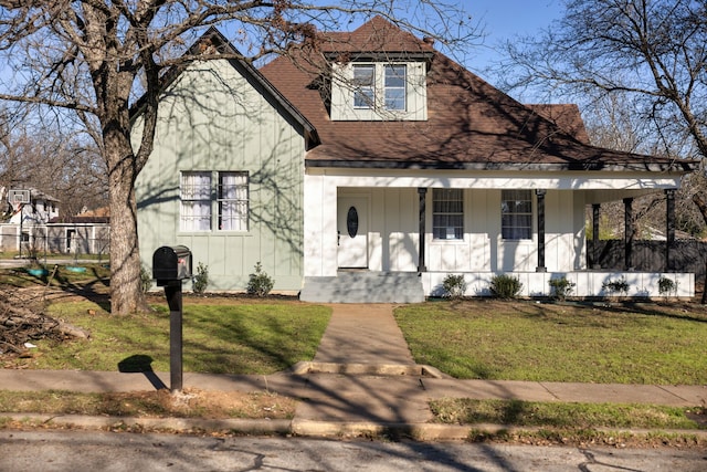 view of front of house featuring a front yard and a porch