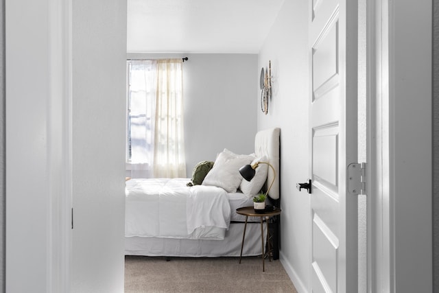 bedroom with light carpet