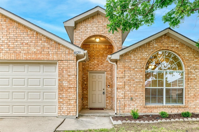 view of exterior entry featuring a garage