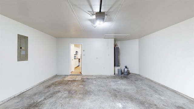 garage with electric water heater and electric panel