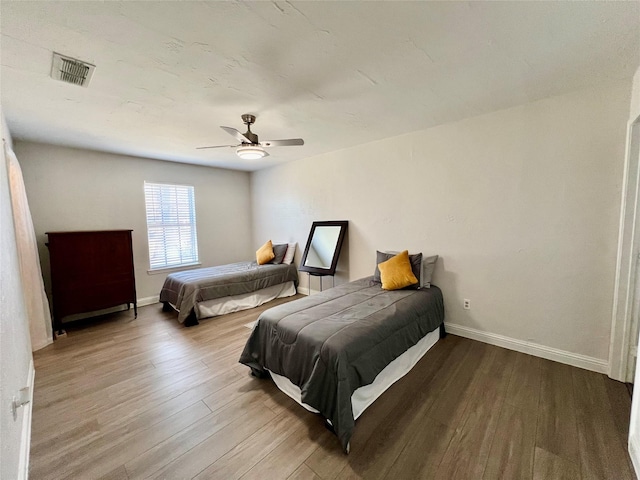 bedroom featuring light hardwood / wood-style flooring and ceiling fan