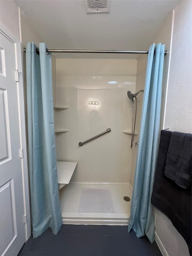 bathroom featuring walk in shower