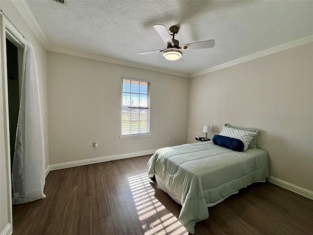 bedroom with a textured ceiling, ceiling fan, dark hardwood / wood-style floors, and crown molding