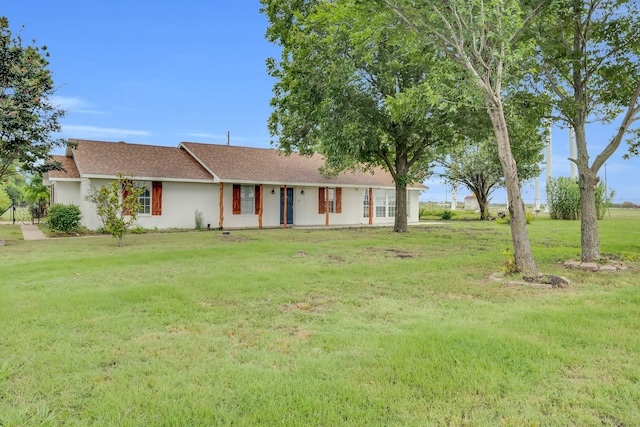 ranch-style home with a front lawn