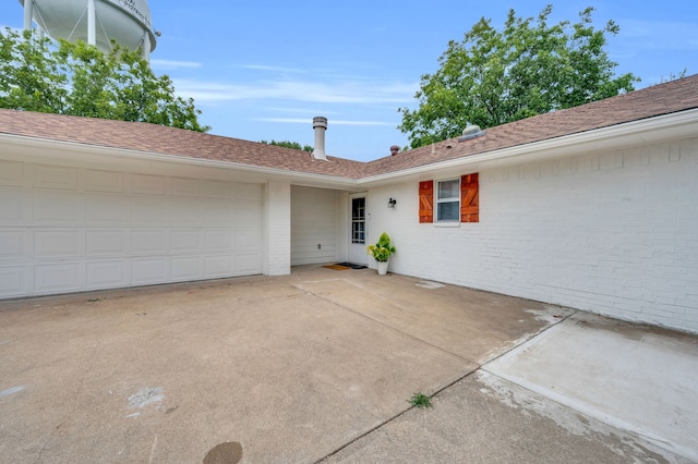 doorway to property featuring a garage