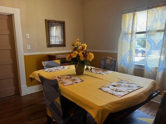 dining area featuring dark hardwood / wood-style flooring