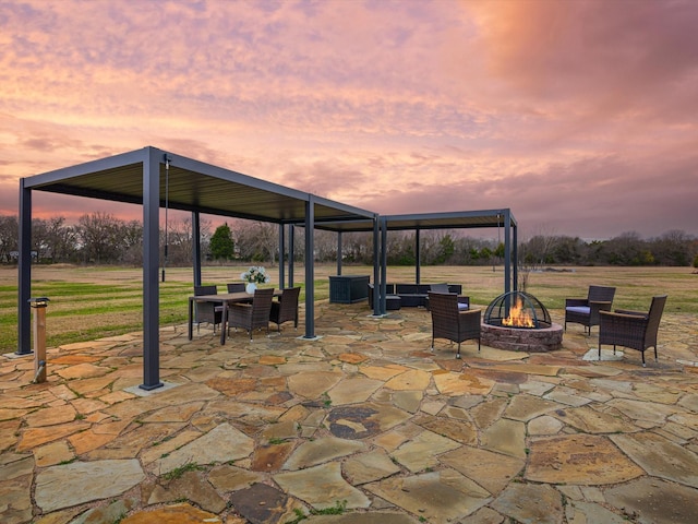 patio terrace at dusk with a fire pit