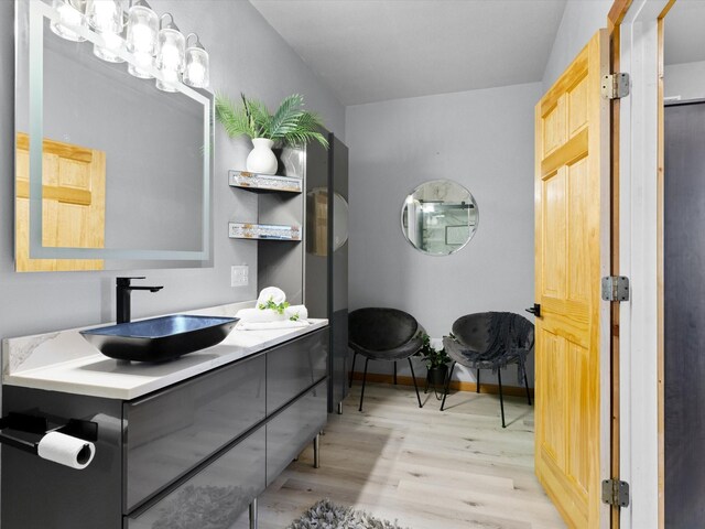 bathroom featuring tiled shower / bath combo and vanity