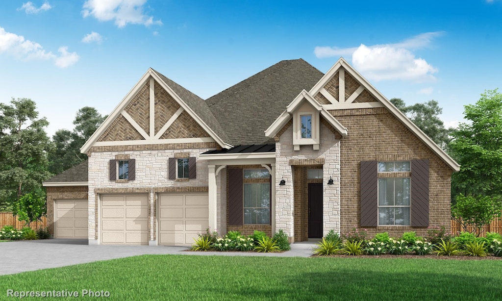 craftsman house with a garage and a front lawn