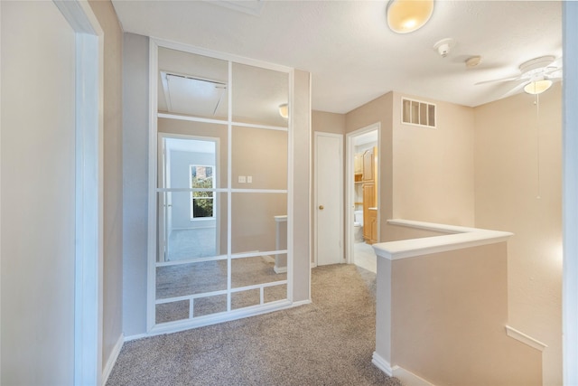 corridor with carpet floors