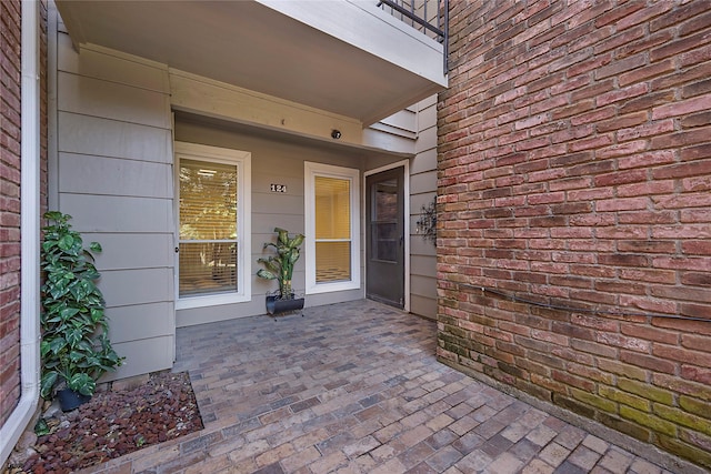 entrance to property with a balcony