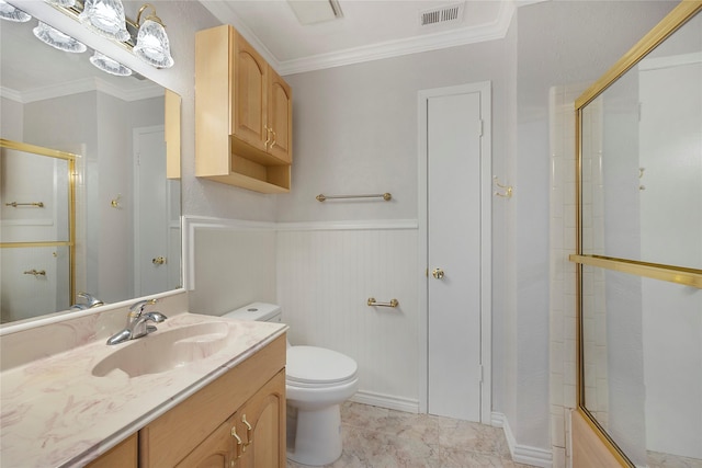 full bathroom featuring vanity, toilet, ornamental molding, and bath / shower combo with glass door