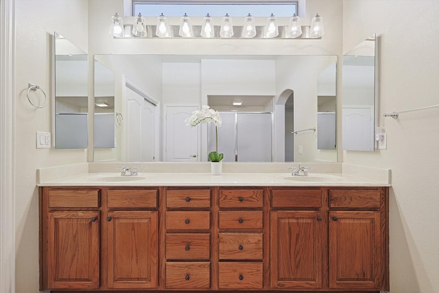 bathroom with vanity and an enclosed shower