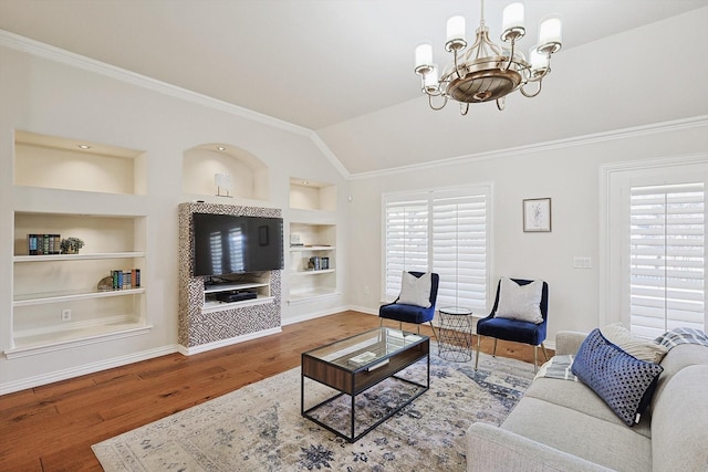 living room with built in shelves, crown molding, a chandelier, vaulted ceiling, and hardwood / wood-style flooring