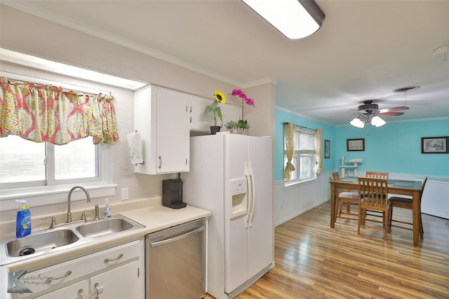 kitchen featuring white cabinets, sink, stainless steel dishwasher, white fridge with ice dispenser, and ornamental molding