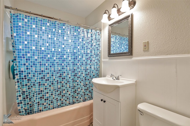 full bathroom with vanity, toilet, and shower / bath combo with shower curtain