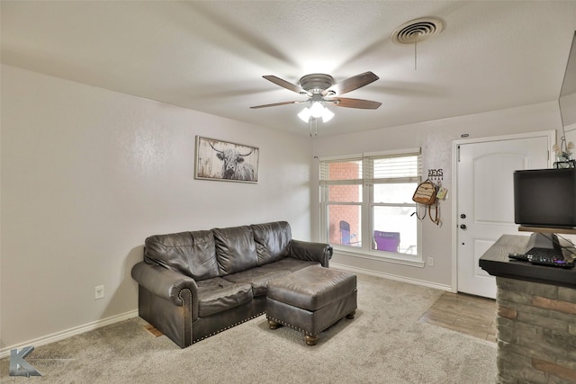 living room with carpet flooring and ceiling fan