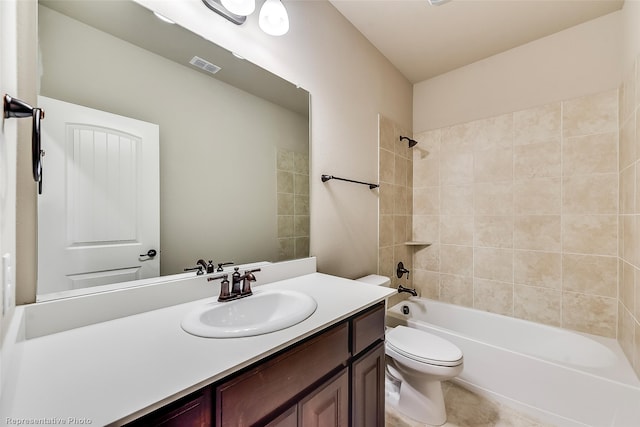 full bathroom with vanity, toilet, and tiled shower / bath combo