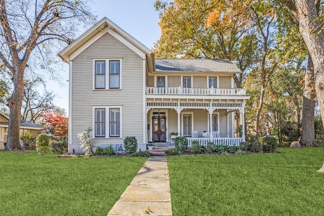 view of front of home with a front yard and a porch