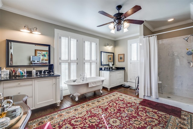 bathroom featuring vanity, wood-type flooring, shower with separate bathtub, and ornamental molding