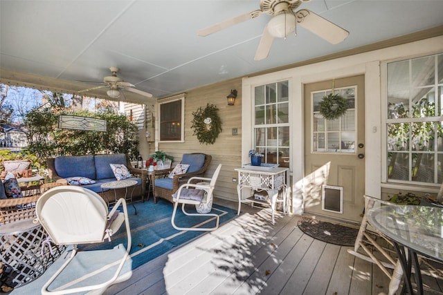 wooden deck featuring an outdoor hangout area