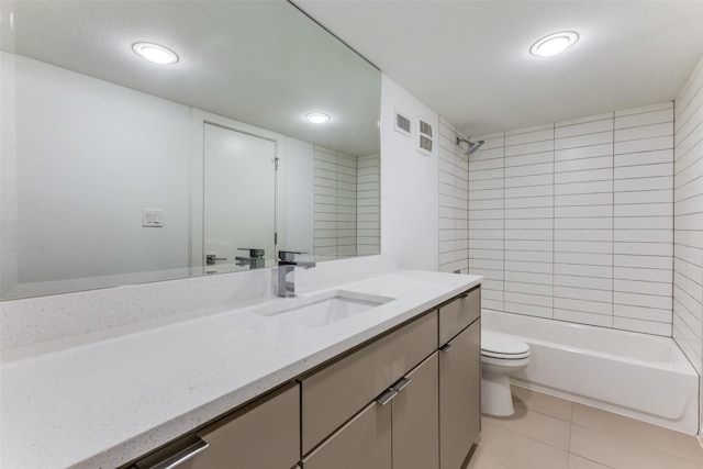 full bathroom with tile patterned flooring, vanity, toilet, and tiled shower / bath combo