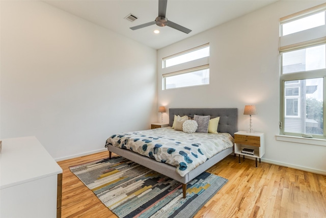 bedroom featuring ceiling fan and light hardwood / wood-style flooring