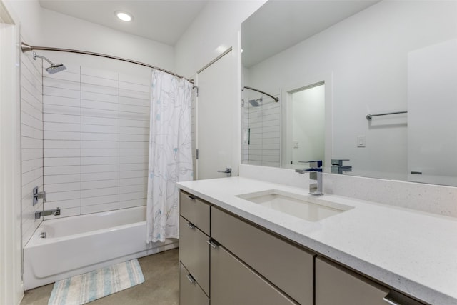 bathroom featuring shower / bath combo with shower curtain and vanity