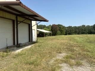 view of yard with a garage