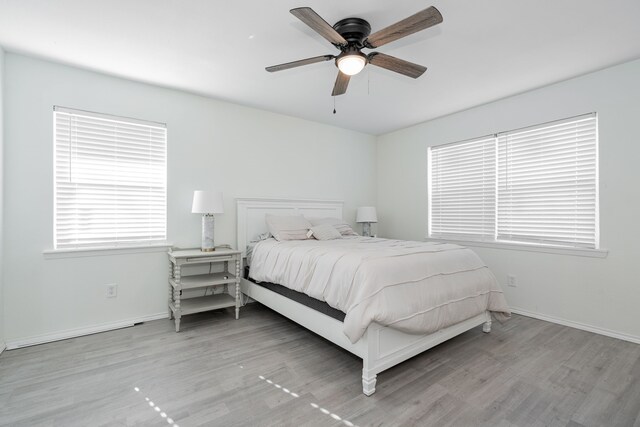 bedroom featuring light wood-type flooring and ceiling fan