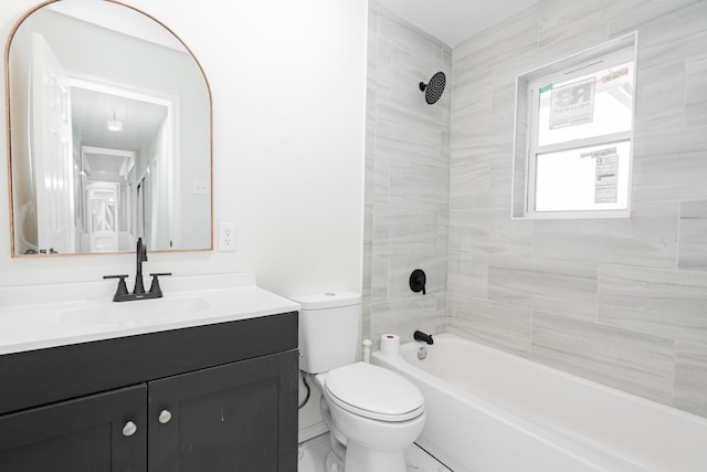 full bathroom with vanity, toilet, and tiled shower / bath