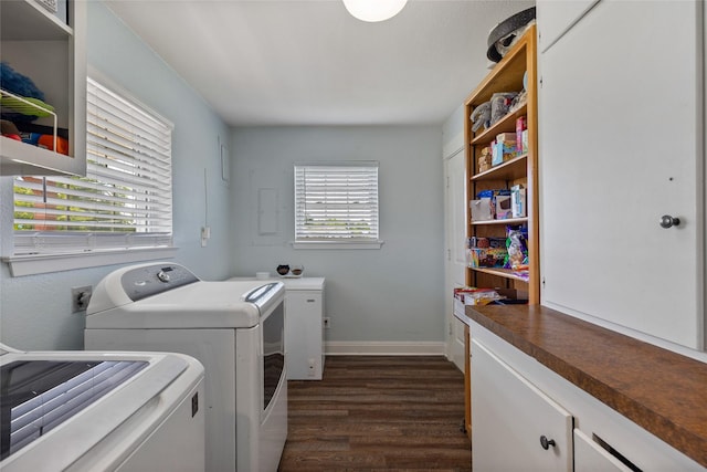 laundry room featuring dark hardwood / wood-style flooring and washer and dryer