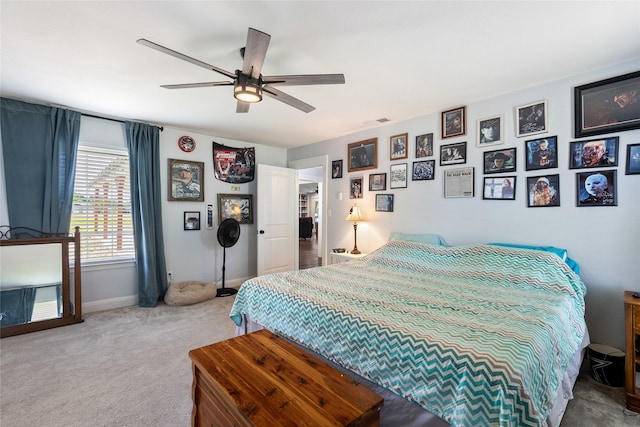 bedroom featuring ceiling fan and light colored carpet