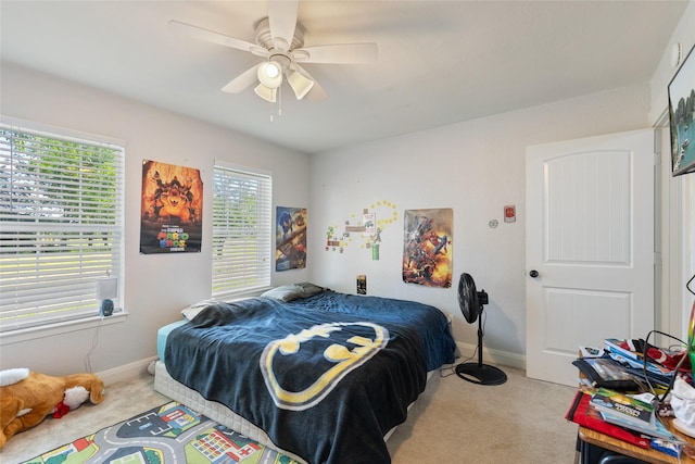 carpeted bedroom featuring ceiling fan