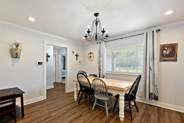 dining space featuring dark hardwood / wood-style flooring, crown molding, and a notable chandelier