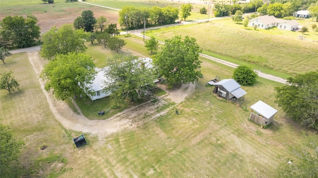 birds eye view of property with a rural view