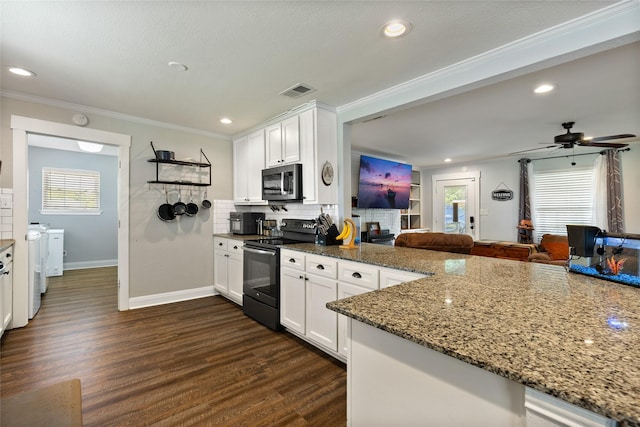 kitchen featuring black electric range, white cabinetry, ceiling fan, and dark stone countertops