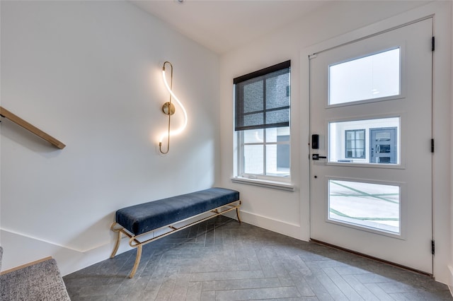 doorway featuring parquet flooring