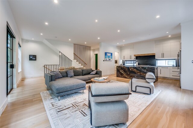 living room with light hardwood / wood-style flooring