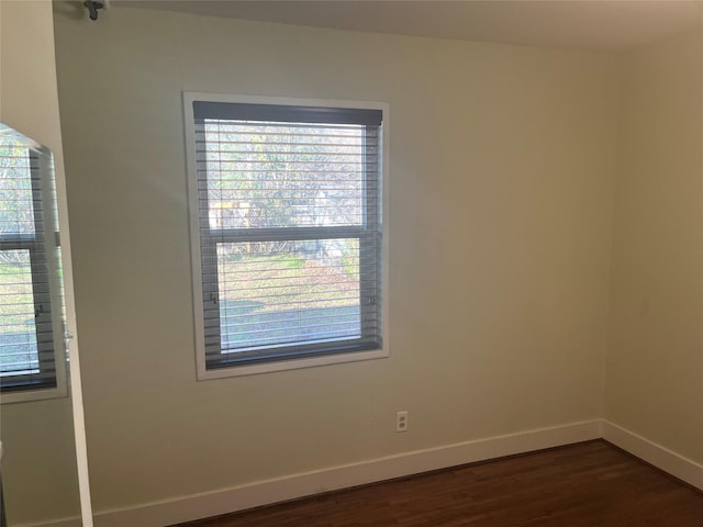 empty room featuring dark hardwood / wood-style floors