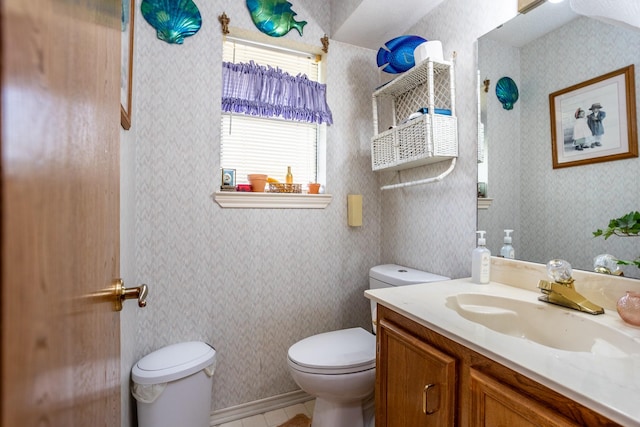 bathroom featuring vanity and toilet