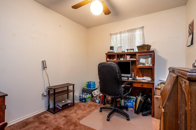 home office featuring ceiling fan and carpet