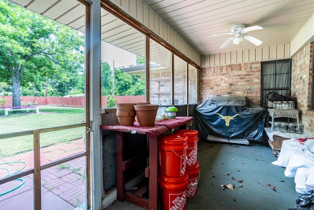 sunroom / solarium with a wealth of natural light and ceiling fan