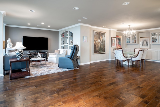 living room featuring ornamental molding, dark wood-type flooring, and an inviting chandelier