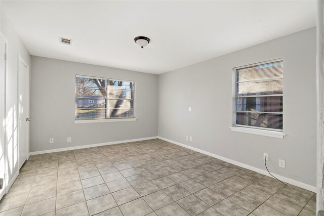 view of tiled spare room