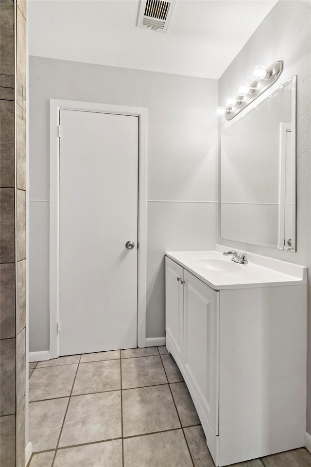 bathroom featuring tile patterned floors, visible vents, and vanity